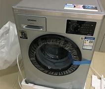 洗衣机甩干(洗衣机甩干时声音特别大是什么原因)